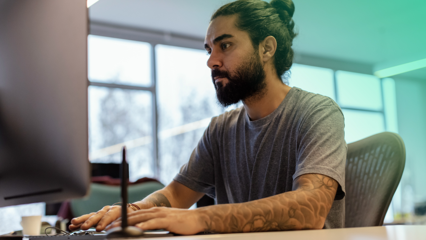 Picture of a man sitting with laptop