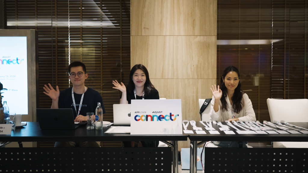 The AppLovin and Adjust teams greet guests at Connects Bangkok