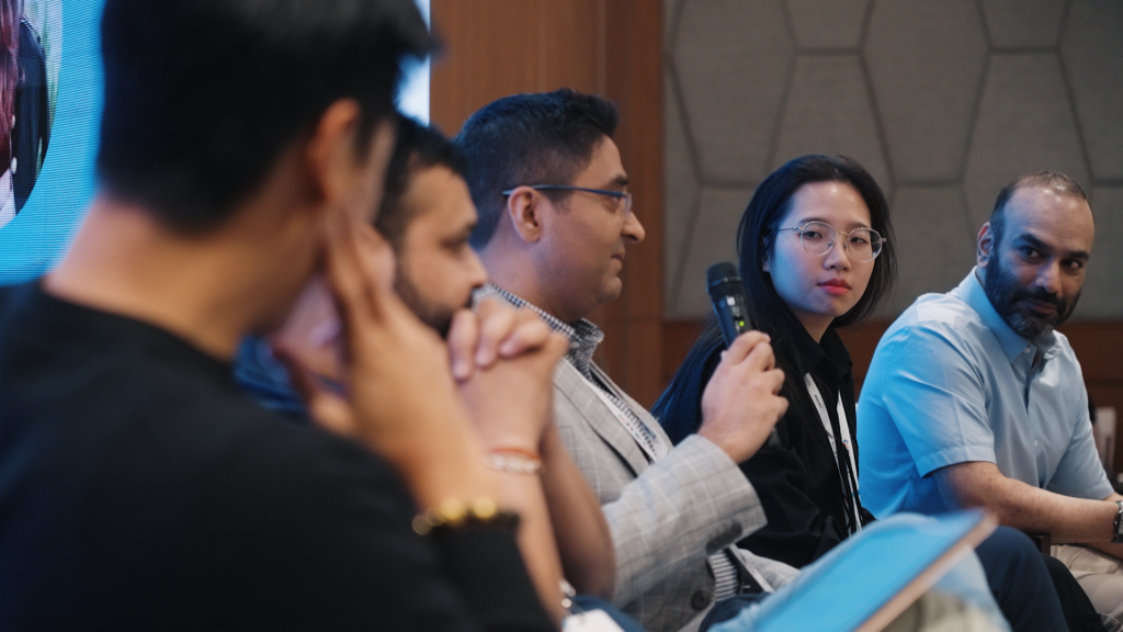 A panel discussion at Connects Bangkok features Varun Krishna, Trish Dang, Sachin Gupta, and Manish Wali, moderated by Alex Li. The panel discussed the ways AI tools are impacting growth for non-gamingapps.